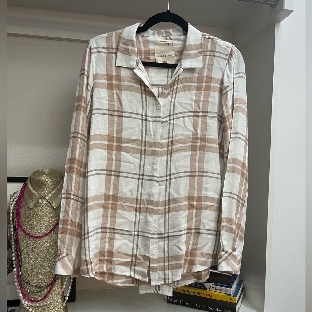 Asymmetrical plaid button down shirt.